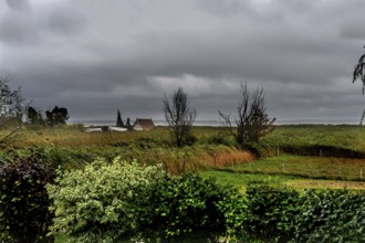 Dark rain clouds (Nimbostratus) over the lagoon, Ahrenshoop, Darß, Mecklenburg-Western Pomerania,