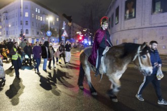Rider on horseback during the lantern parade for Marting Day in Berlin Moabit on 11.11.2025