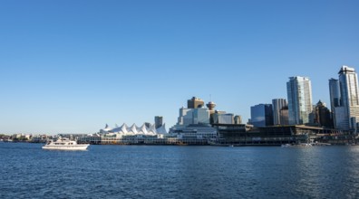 Skyline, skyscrapers and Canada Place on the promenade, Vancouver, British Columbia, Canada