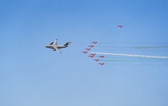 The Indian Air Force aerobatic team performs during an air show as part of the 93rd Air Force Day