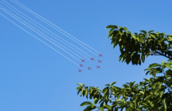 The Indian Air Force (IAF) Surya Kiran aerobatics team performs during an air show as part of the