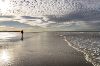 Walkers on the Wadden Sea near the East Frisian island of Spiekeroog, west of the North Sea island,