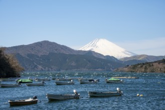 Attached rowing boats, view of Lake Ashi with Mount Fuji volcano, Hakone, Japan