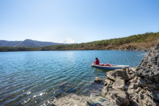 Anglers at Lake Saiko, behind volcano Mt. Fuji, Minamitsuru District, Yamanashi Prefecture, Japan