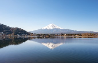 Volcano Mt. Fuji is reflected in Lake Kawaguchi, Yamanashi Prefecture, Japan