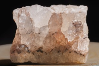 This clear quartz crystal is highlighted by its fascinating structure. Details of its surface