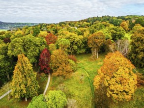 Autumn colours over Bodnant House and Garden from a drone, Conwy River, Colwyn Bay, Conwy, Wales,