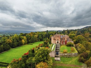 Autumn colours over Powis Castle and Garden from drone, Welshpool, Powys, Wales, England, United