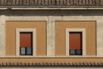 Windows of a building in the city of Rome, Italy