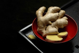 Ginger, ginger root in tea bowl, Zingiber officinale, tea preparation