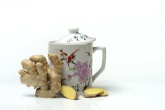 Ginger root with cup, ginger tea
