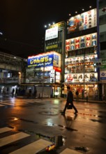 Street with illuminated shops at night in Akihabara, Electric City, Tokyo, Japan