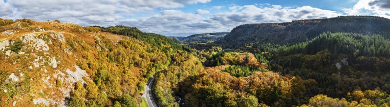 Autumn colours over Gwydir Forest Park from a drone, Afon Lledr, Road A470, Snowdonia, Eryri,