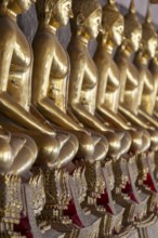Gilded Buddha statues (Bhumispara mudra: Buddha Gautama at the moment of enlightenment), Wat Suthat