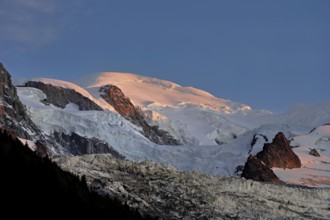 Snow-covered Mont-Blanc in the light of the setting sun, Chamonix-Mont-Blanc, Haute-Savoie, France