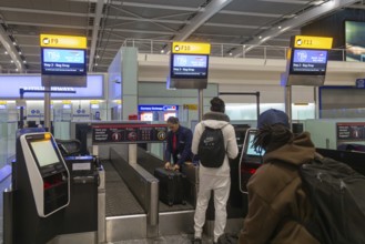 British Airways check in bag drop area, Terminal 5 London Heathrow airport, London, England, UK