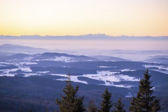 View from Mount Lusen over the hills of the bavarian forest at sunrise in winter, Bavaria, Germany