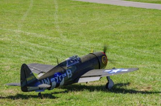 An RC model of a Republic P-47 Thunderbolt during a demonstration as part of an air show at the