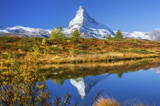 Matterhorn 4478 m with reflection in Leisee on the Sunnegga in autumn, Zermatt, Mattertal, Valais,