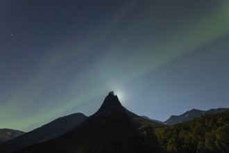 National mountain of Norway - Stetind in the Nordland under auroras and a full moon