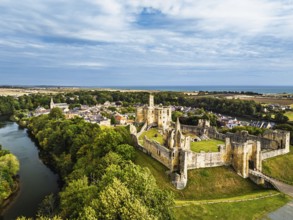 Warkworth Castle over River Coquet from a drone, Warkworth, Northumberland, England, United Kingdom
