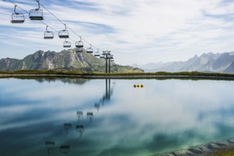 Mountain landscape with reservoir and chairlift, Saloberkopf, Warth, Bregenzerwald, Vorarlberg,