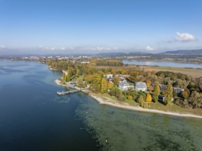 Aerial view of the Mettnau peninsula, surrounded by autumn vegetation, in western Lake Constance