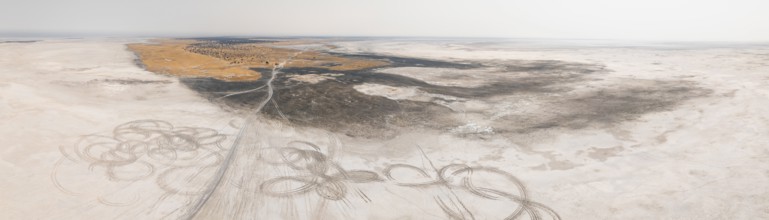 Aerial view, tire tracks on a salt pan, arid landscape, Botswana