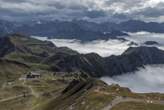 View from the Nebelhorn summit to mountains of the Allgäu Alps, mountains rising from fog in the