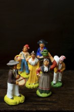 Colorful Provençal terracotta figurines represent traditional characters from rural life. Each