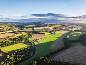 Fields and Farms over River Teviot and Minto Crags from a drone, Roxburghshire, Scottish Borders,