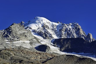 Aiguille des Grands Montets and snow-covered Aiguille Verte, Chamonix-Mont-Blanc, Haute-Savoie,