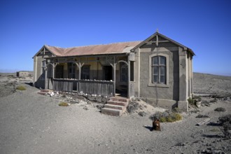 Dilapidated building in the desert sand, Pomona, restricted diamond area, near Lüderitz, Karas