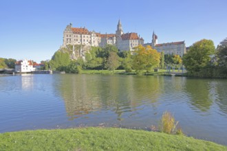 Hohenzollern Castle and Danube, river bank with autumn colours, landmark, castle, Sigmaringen,