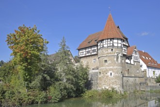 Zollern Castle built around 1255 with water tower on the Eybach stream, half-timbered house,