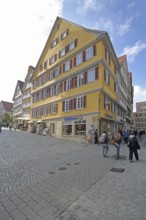 Yellow half-timbered house built in the 16th century, pedestrian, Holzmarkt, Tübingen, Neckar