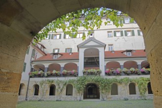 Protestant monastery built in 1534, inner courtyard with arcade and floral decoration, archway,