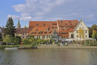 Half-timbered houses, town mill, tithe barn on the banks of the Neckar, pedestrians, boats,