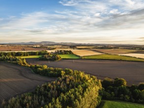 Sunset of Farms and Fields over Norham Castle from a drone, Norham, River Tweed, Northumberland,