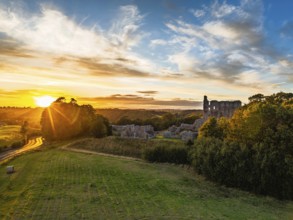 Sunset over Norham Castle and River Tweed from a drone, Norham, Northumberland, England, United