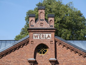 Brick façade with inscription Werla, former paper factory and mill for the production of groundwood