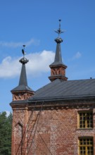 Gable with weather vane and ornamental iron elements, former paper factory and mill for the