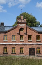Brick façade with inscription Werla, former paper factory and mill for the production of groundwood