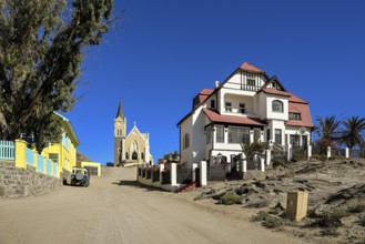 Colonial house facade in the Kirchstraße, in the background the rock church, Lüderitz, Karas