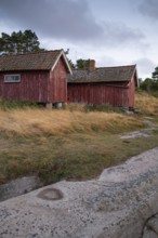 Falun red or Swedish red boathouses by the sea, Resö Island, Bohuslän, Skagerrak, Sotenäs, Västra