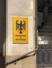 Yellow information signs, federal eagle with reference to federal ministries located there in the