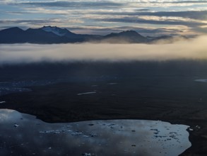 Ice floes, glacier, glacier tongue, fog, clouds, morning mood, mountains, reflection, aerial view,