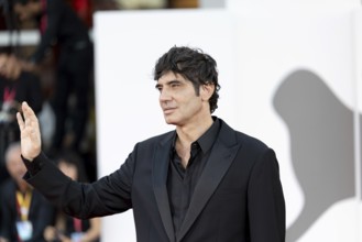 Venice, Italy - 3 September 2025: Pietro Marcello during the red carpet of - Duse - during the 82nd