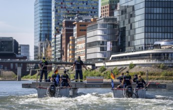 Exercise run of a multi-purpose pontoon on the Rhine, Medienhafen, the skipper gives instructions