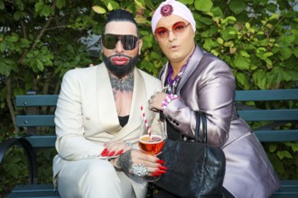 Harald Glööckler and Julian F.M. Stöckel at the premiere of the play 'Der eingebildet Kranke' and